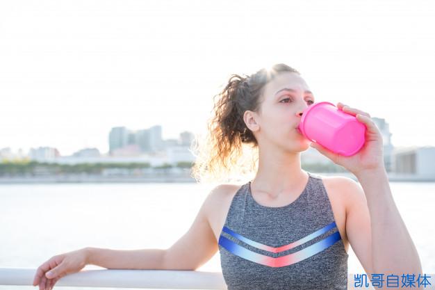 pretty-sporty-girl-drinking-from-shaker-outdoors_1262-6185.jpg